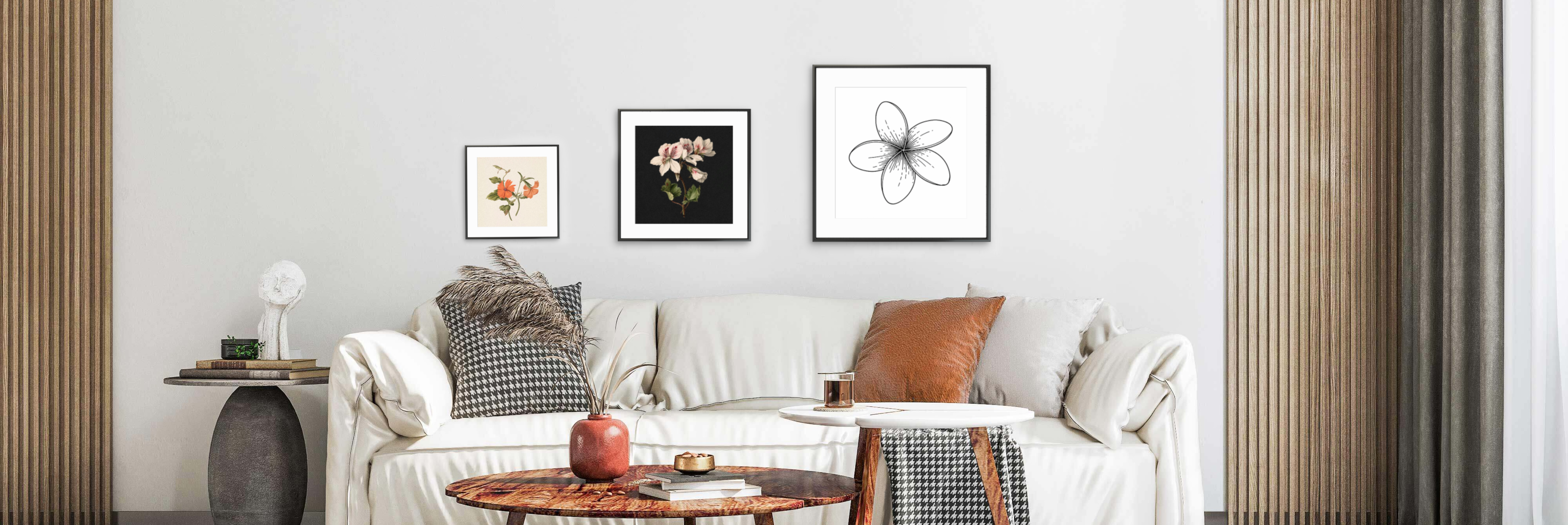 Framed travel posters on a wooden cabinet in a minimalist room